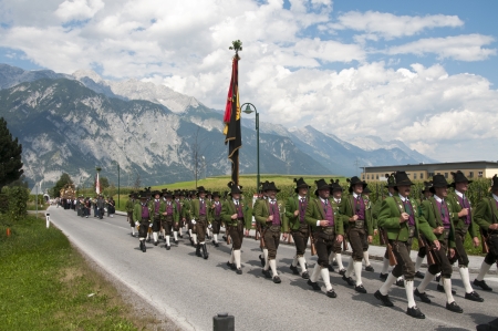 AXAMS,AUSTRIA - AUGUST 15 Unidentified people walking in procession to the church on Maria Ascension,on August 15, 2012 in Axams, Austria  Maria Ascension is the anual christian celebration in Axamのeditorial素材