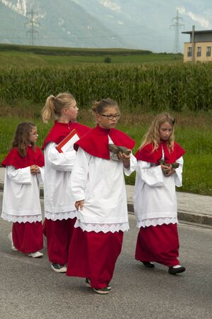 AXAMS,AUSTRIA - AUGUST 15 Unidentified people walking in procession to the church on Maria Ascension,on August 15, 2012 in Axams, Austria  Maria Ascension is the anual christian celebration in Axamのeditorial素材