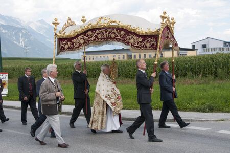 AXAMS,AUSTRIA - AUGUST 15 Unidentified people walking in procession to the church on Maria Ascension,on August 15, 2012 in Axams, Austria  Maria Ascension is the anual christian celebration in Axamのeditorial素材