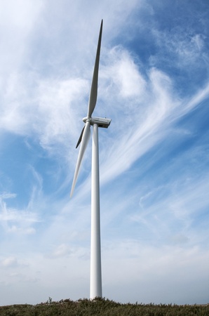 windmill with blue sky and white cloudsの写真素材