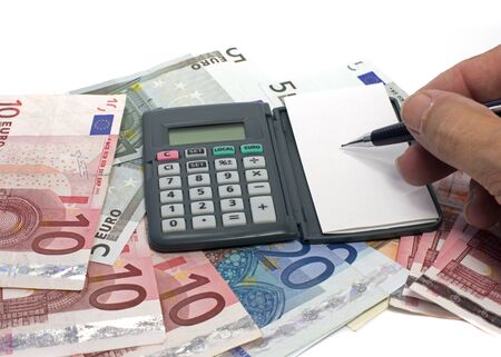 writing and calculating with euro moneyの写真素材