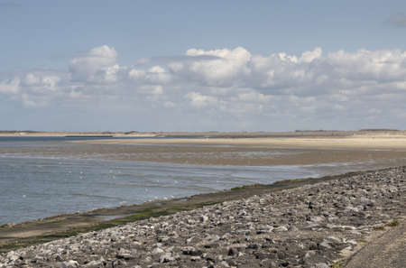 landscape of the dutch coast with sand beach and seaの写真素材
