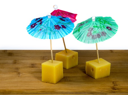 dutch cheese snacks with umbrella in blue red and greenの写真素材