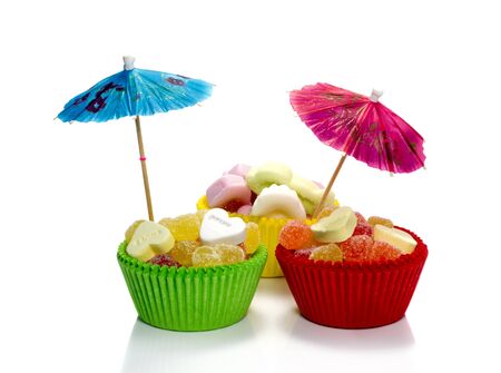 bleu and red umbrella in sweet candy cupcakesの写真素材