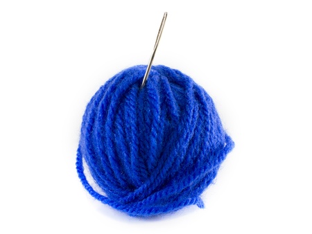 ball of blue wool and metal needleの写真素材