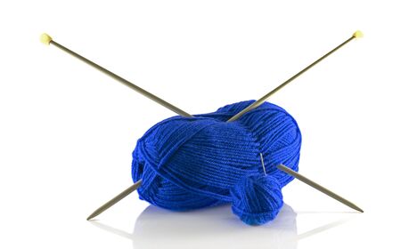 knitting needles and blue wool isolated on whiteの写真素材