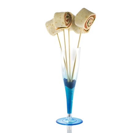 wooden sticks with salmon wraps isolated on whiteの写真素材