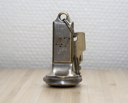 hotel key number forty seven on wooden tableの写真素材