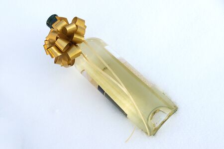 bottle white wine in the snowの写真素材