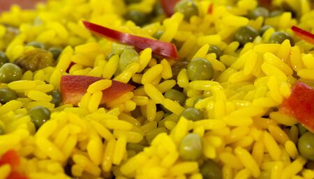 diner dish with yellow rice and red peppersの写真素材