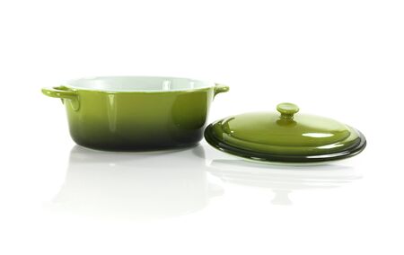 green frying pan isolated on whiteの写真素材