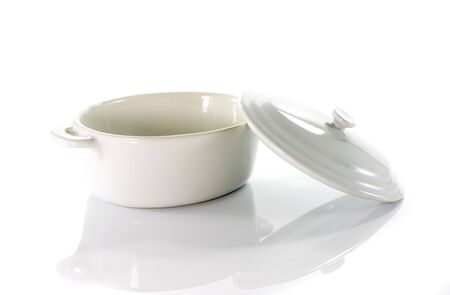 white frying pan with cover isolated on backgroundの写真素材