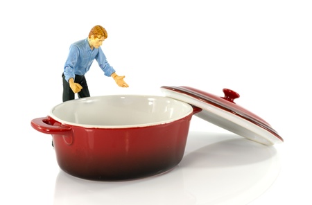 model man looking in red empty saucepanの写真素材