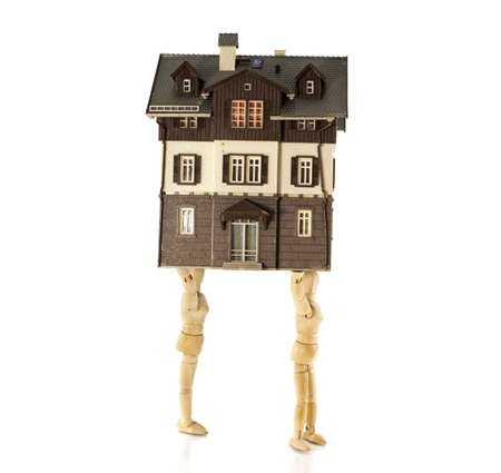 wooden puppets moving the houseの写真素材