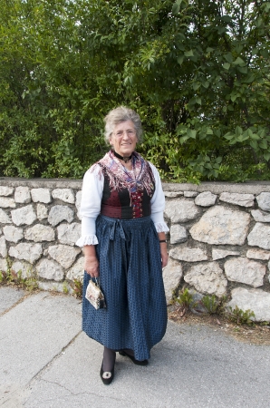 AXAMS,AUSTRIA - AUGUST 15 Unidentified woman showing traditonal dress,on August 15, 2012 in Axams, Austria This dress is worn only at  Maria Ascension is the annual christian celebration in Axamのeditorial素材