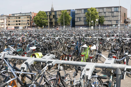 many bikes at railroad station in holland europeのeditorial素材