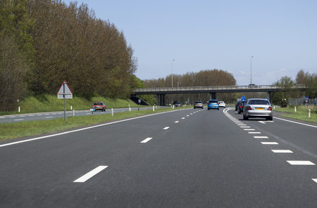 cars driving on the highway in hollandの写真素材