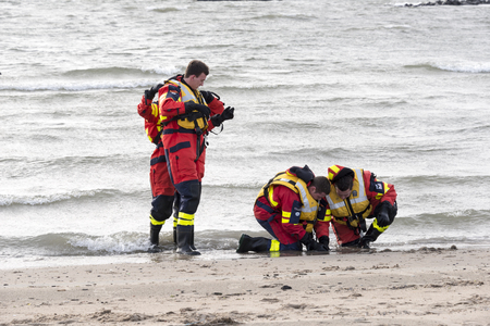 rescue divers checking the water for the new years dip in Hollandのeditorial素材