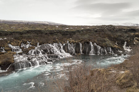 Hraunfossar waterfall with blue water on icelandの写真素材