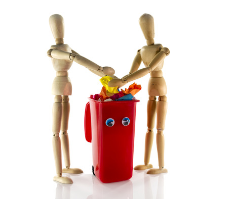 two wooden people collection garbage for better environmentの写真素材