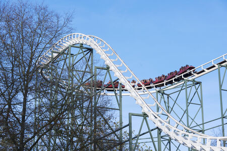 people in roller coaster on amusement park in hollandの写真素材