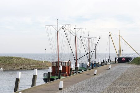 fishing boat in harbor ouddorp, a village in the netherlandsの写真素材