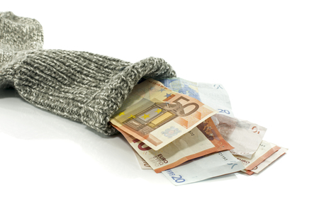 because of the low interst rate people are putting money in a sock to save valueの写真素材
