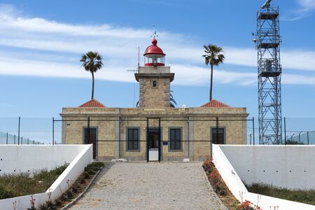 lighthouse on the rocks from Lagos in Portugalの写真素材