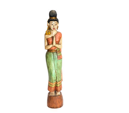 wooden woman from thai culture isolated on whiteの写真素材