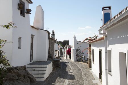 street with white houses monsaraz in alentejo portugalのeditorial素材