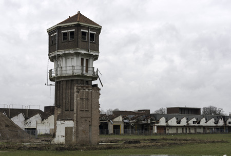 ald textiel factory complex in Holland with the tower and at the background new housesの写真素材