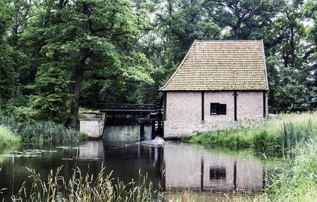 old watermill with bridge in the dutch nature area Twente near the place Deldenの写真素材