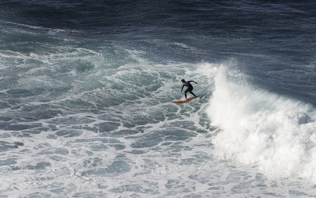 SAO VINCENTE,PORTUGAL-MARCH 24 Unidentified boy surfing on the big waves at the north coast of...