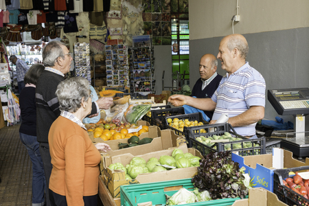 FUNCHAL-PORTUGAL-MARCH 26,Unidentified people buying fruit in the market hall from Funchal on Madeira island on March 2016 in Funchal,this market hall is the biggest on Madeira islandのeditorial素材