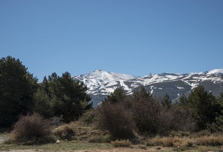snow on the mountain tops of the sierra nevada in andalusia spainの写真素材