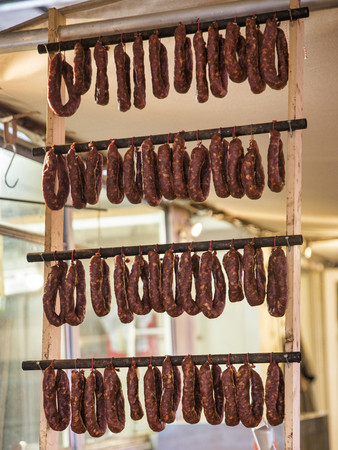 rows of sausages hanging  and dryingの写真素材