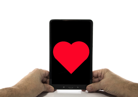 man holding tabklet in his handsの写真素材