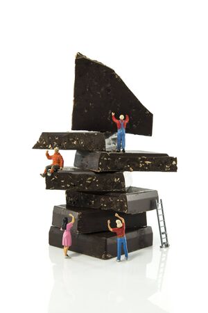 the little figures of little world love chocolate isolated on white backgroundの写真素材