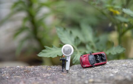 man asks for help through emergency service after a car accident with his red convertible