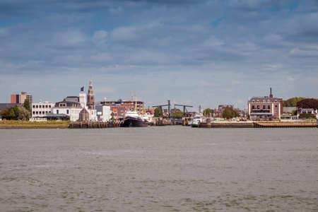 Maassluis,Holland,19-aug-2020: Town of Maassluis seen from the Nieuwe Waterweg with the bridge and the churchのeditorial素材