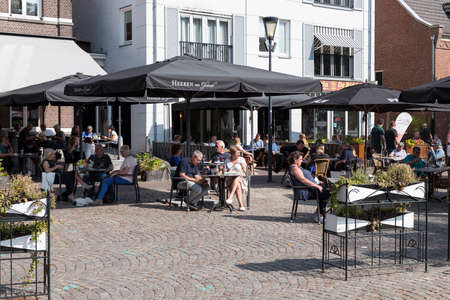 Gemert,Netherlands,13-sep-2020: People enjoy drinks on a cafe terrace on the Grote Markt square in the center of Gemertのeditorial素材