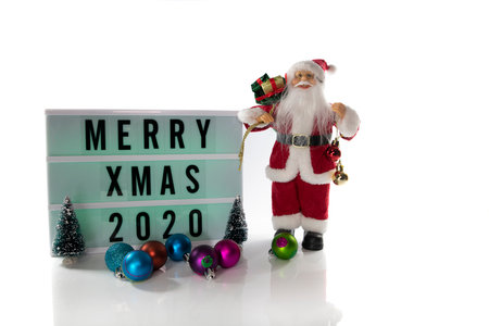 Santa Claus Holding text with merry xmas 2020 with white background and copy spaceの写真素材
