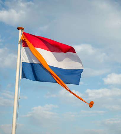 dutch flag with orange pennantの写真素材