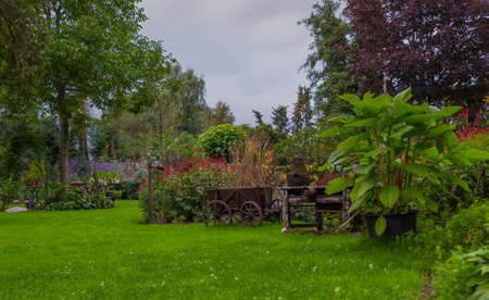 big english garden with green grassの写真素材