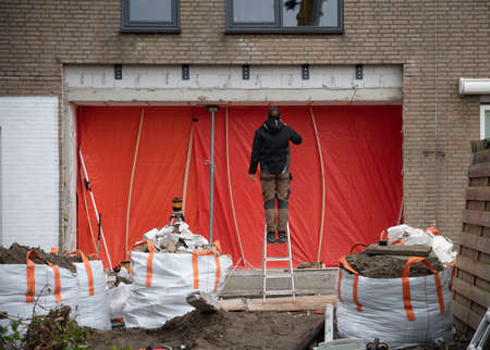 a facade removed from a house for reconstructionのeditorial素材