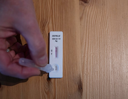 woman busy with coronatest with selftest