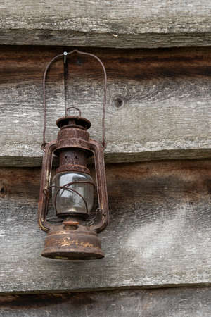wooden shed with old rusted lampの写真素材