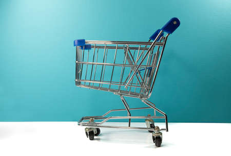 a empty supermarket trolly with white and blueの写真素材