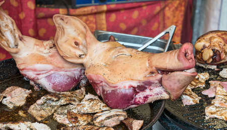 dead pigs head on the market for saleの写真素材