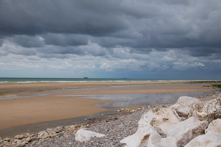 low tide on the beach of cap blanc nez in france with white rocksの写真素材